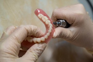 man smiling after getting dentures