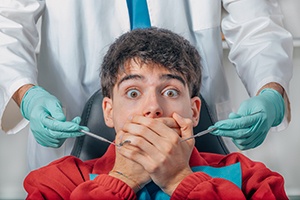 Man afraid in the dental chair