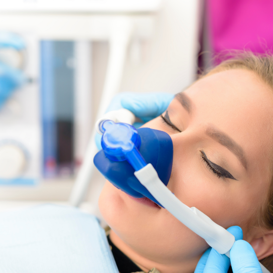 Woman with nitrous oxide mask